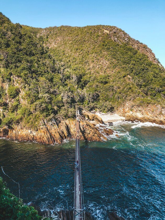 Storms River Mouth, South Africa // Exploring the Garden Route soon? Then be sure to add Storms River Mouth Rest Camp to your travel plans. This guide sets out all the best things to do at Storms River Mouth - from gorgeous hikes to fun adventure activities. Plus, get top insider's tips to help you plan the perfect trip to this scenic gem. //What to do / When to visit/ Pre-travel Tips/ Packing guide// #gardenroute #southafrica #travel #stormsriver #stormsrivermouth #hiking #adventuresports #nature